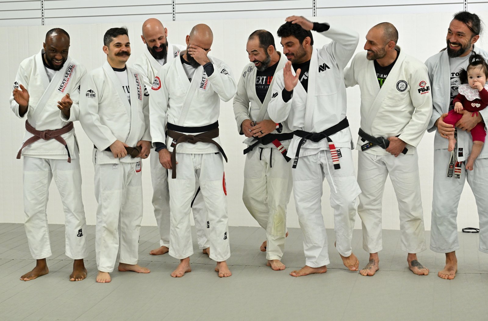 Yves Daberkow Sousa overcome with emotion as his black belt is tied on during a surprise promotion